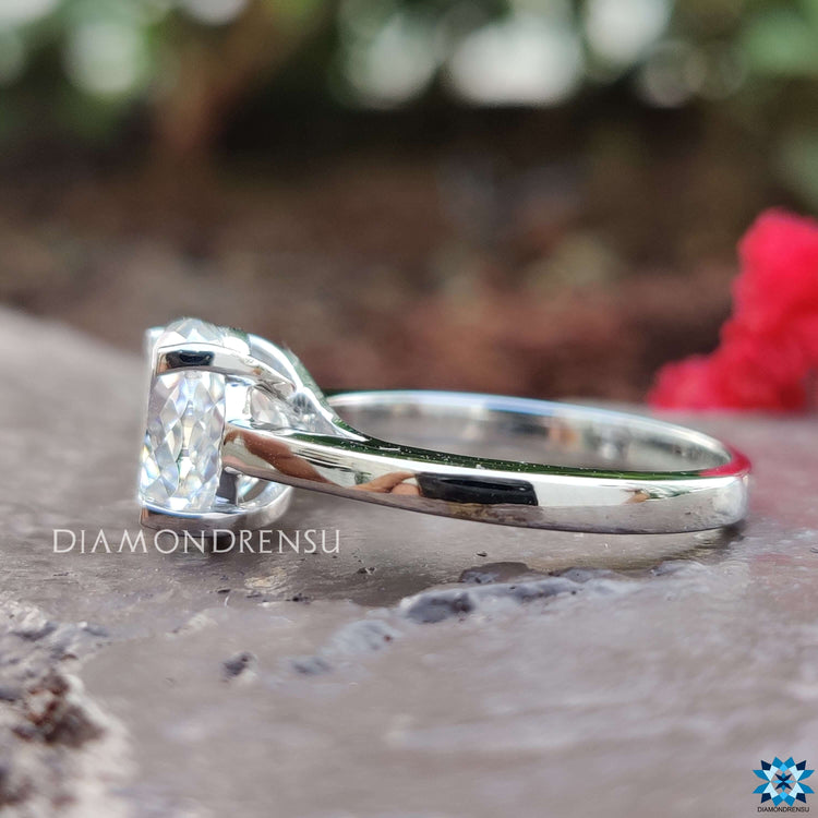 Minimal solitaire ring with a Portuguese cut stone.