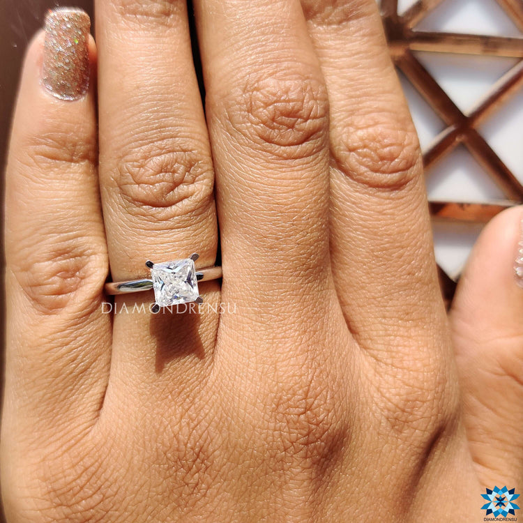 White gold solitaire ring with princess moissanite.