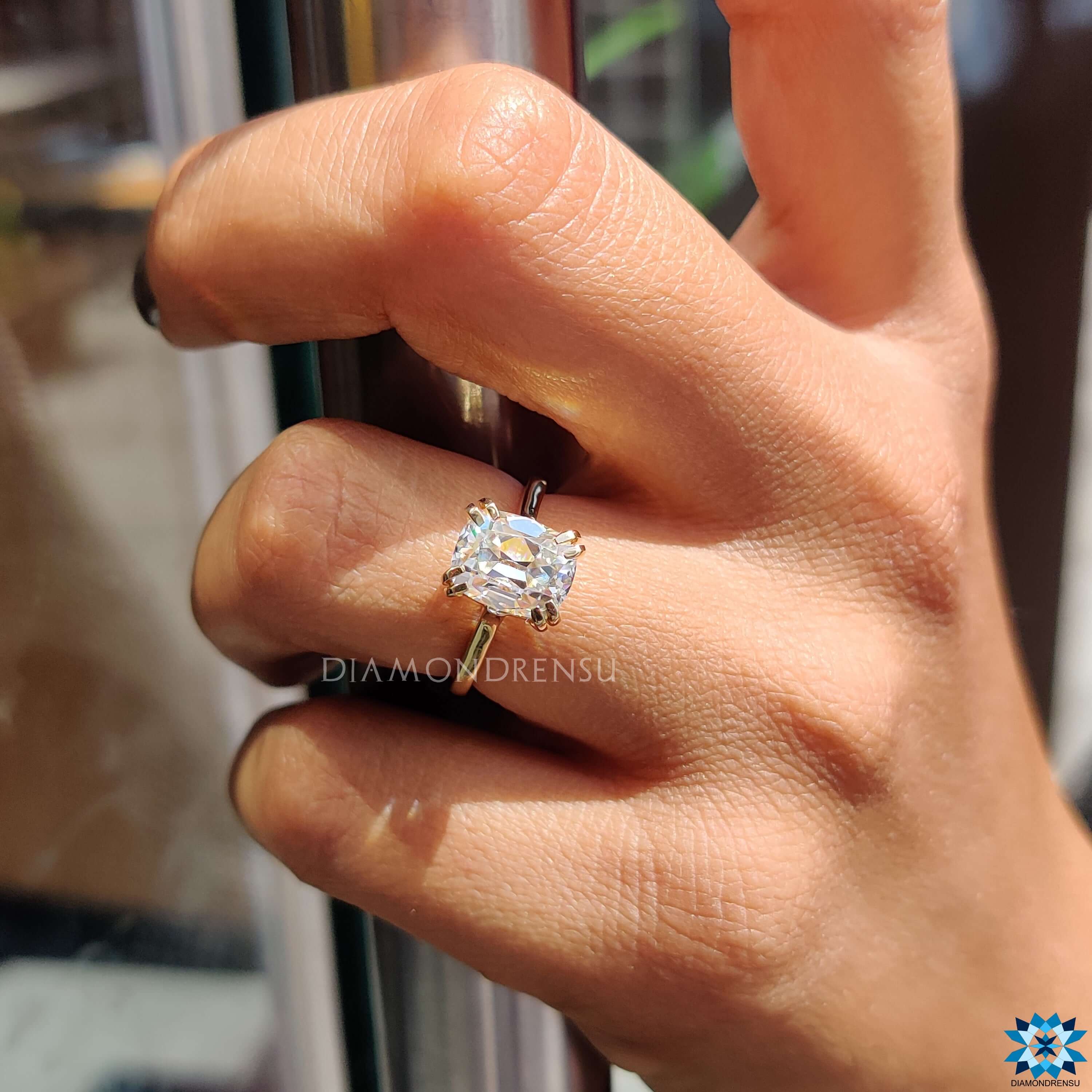 Diamondrensu UK yellow gold cushion moissanite engagement ring.
