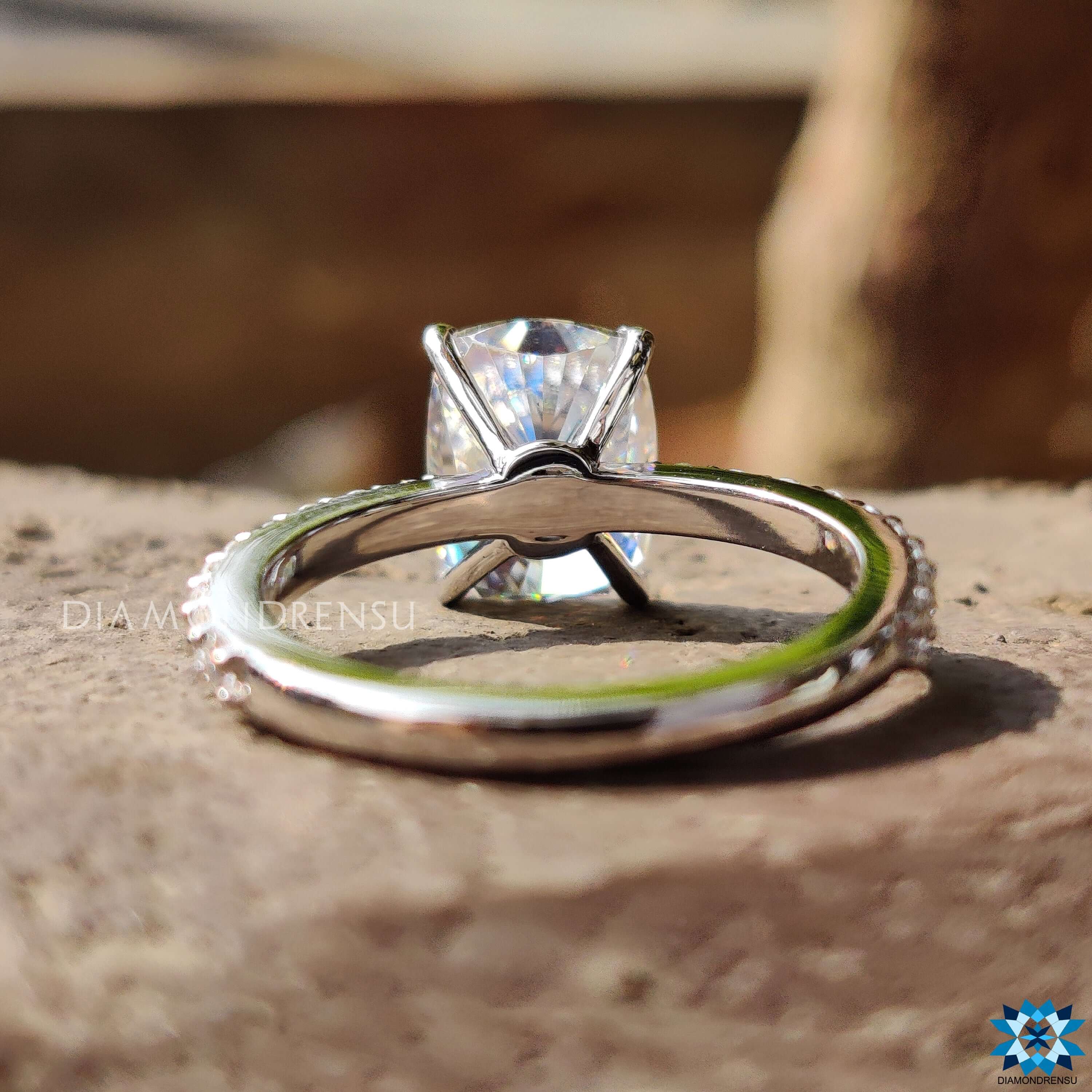 Custom moissanite engagement ring with elongated cushion cut.