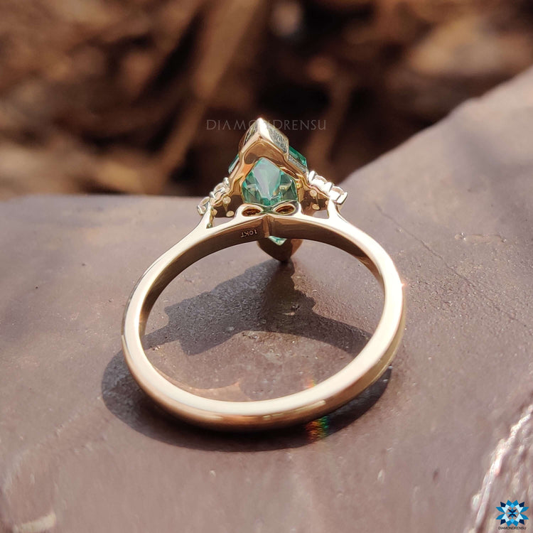 Handmade green marquise moissanite ring with a V prong setting.