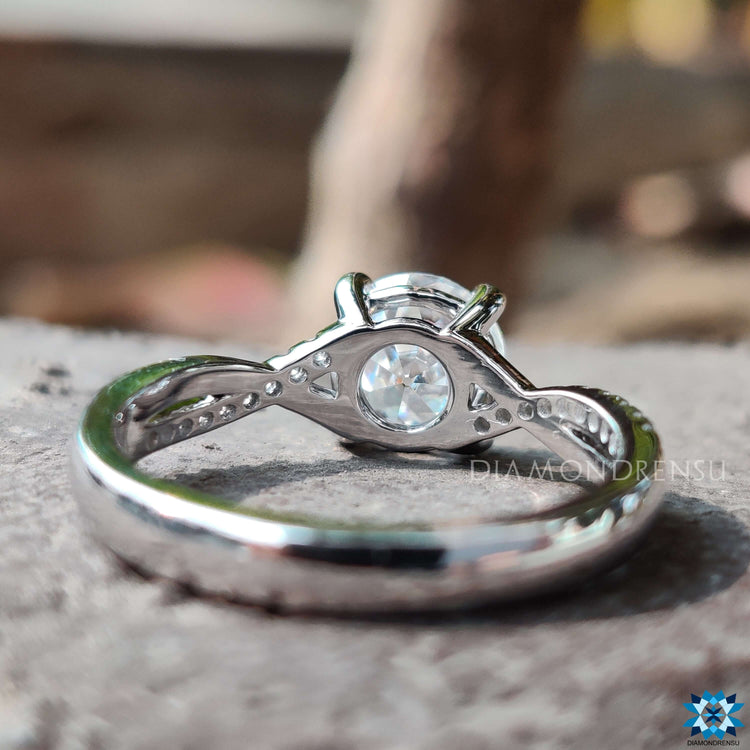Prong setting ring with round old European cut moissanite.
