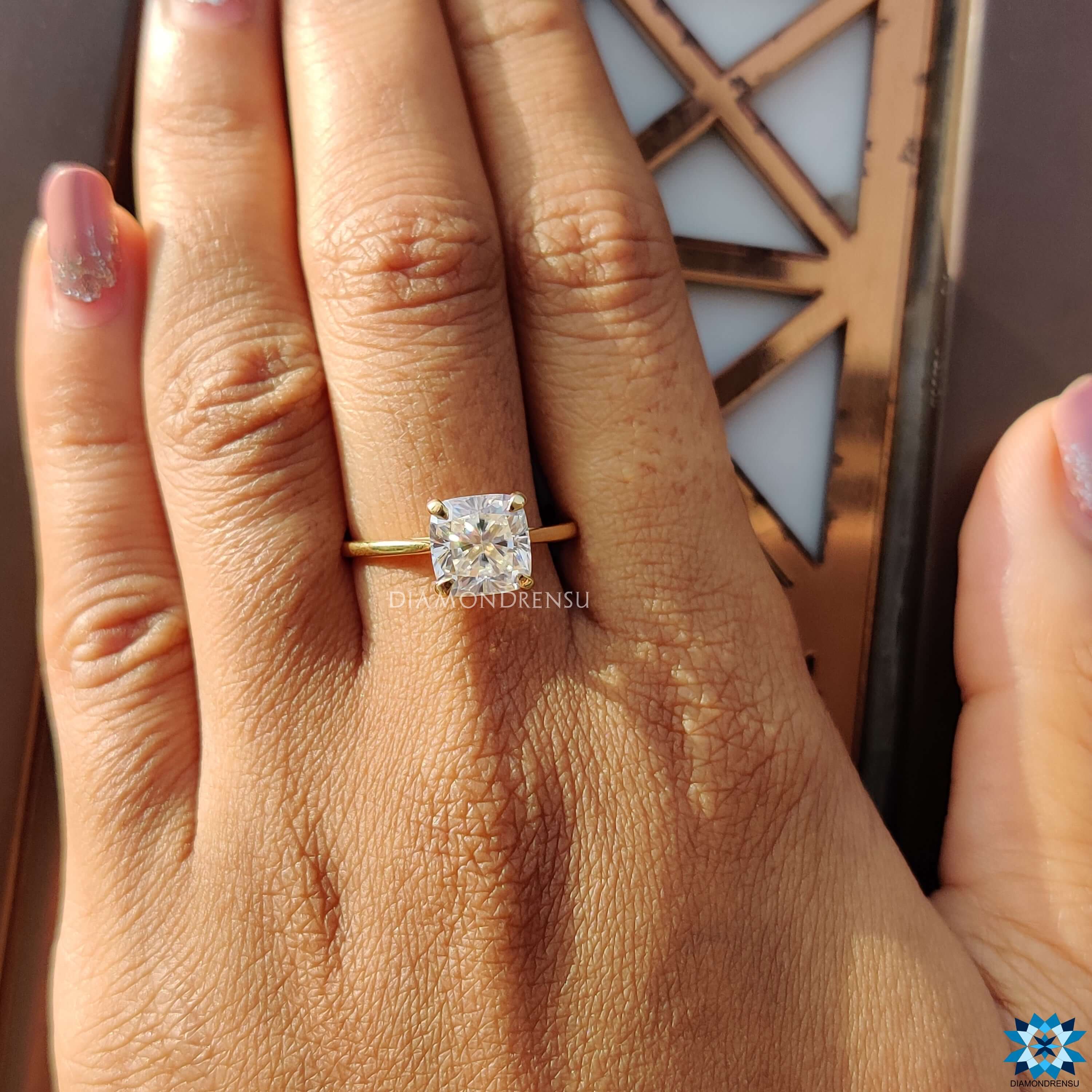 Diamondrensu UK engagement ring with cushion cut moissanite.