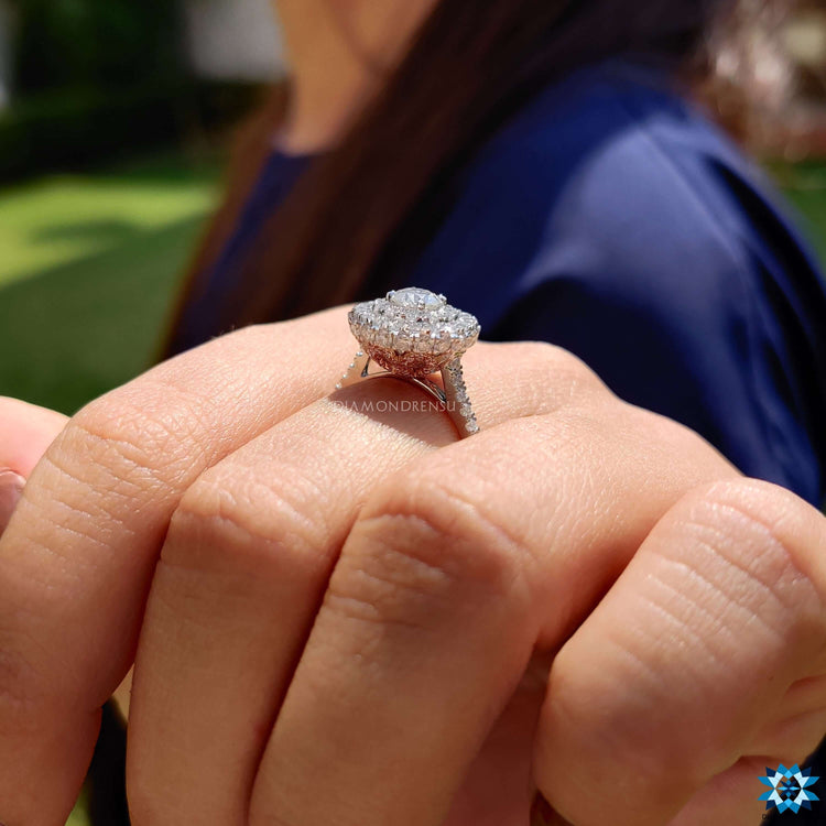Custom engagement ring with double halo and pave band.
