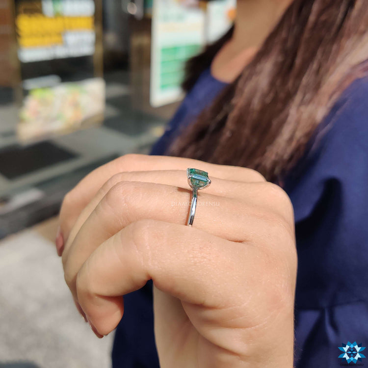 Custom engagement ring with green moissanite.