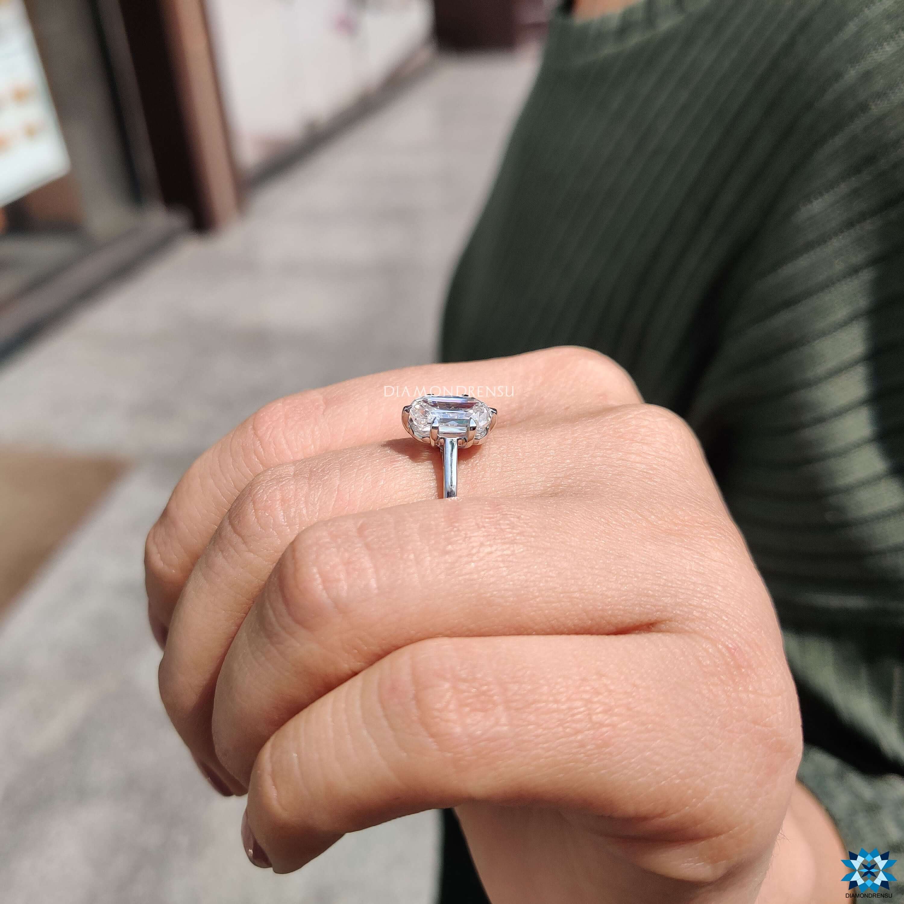 6 prong claw ring holding cushion criss cut moissanite.