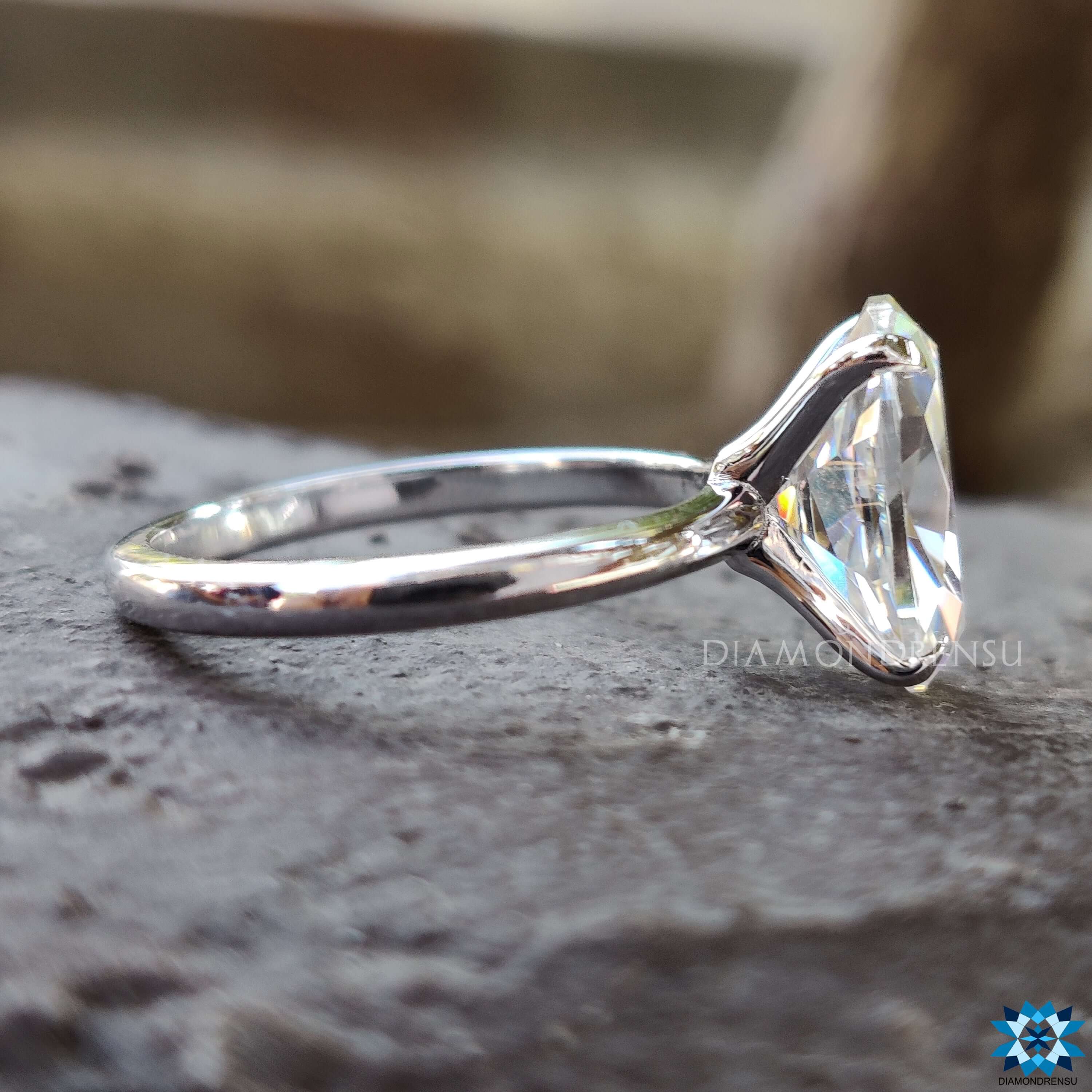 Custom moissanite engagement ring with prong setting.