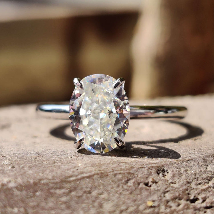 Oval moissanite engagement ring in white gold.