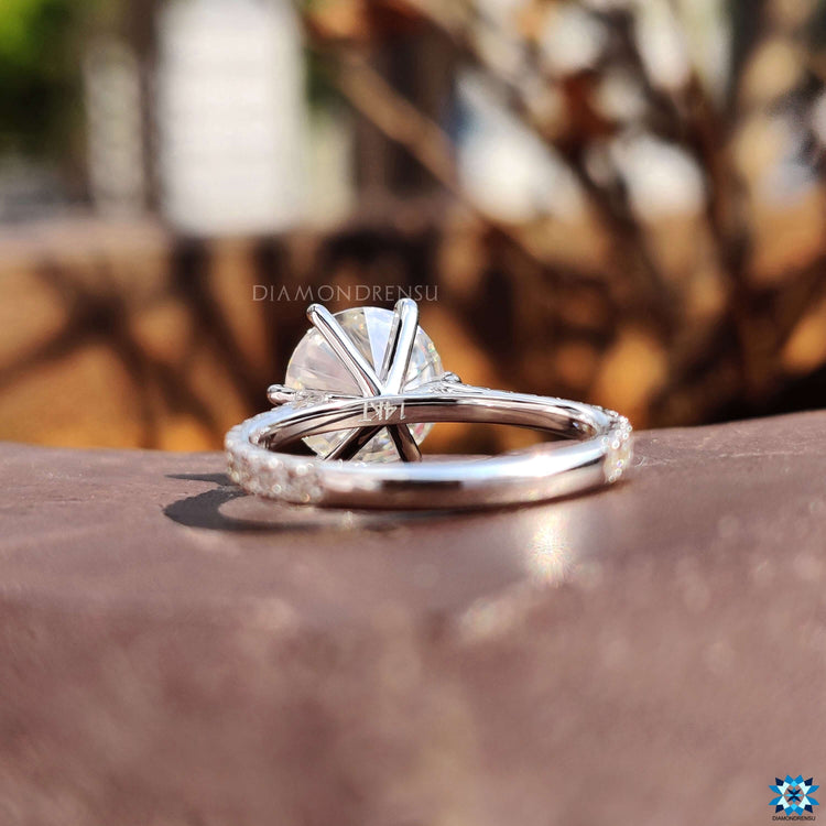 Pave setting ring with round center moissanite.