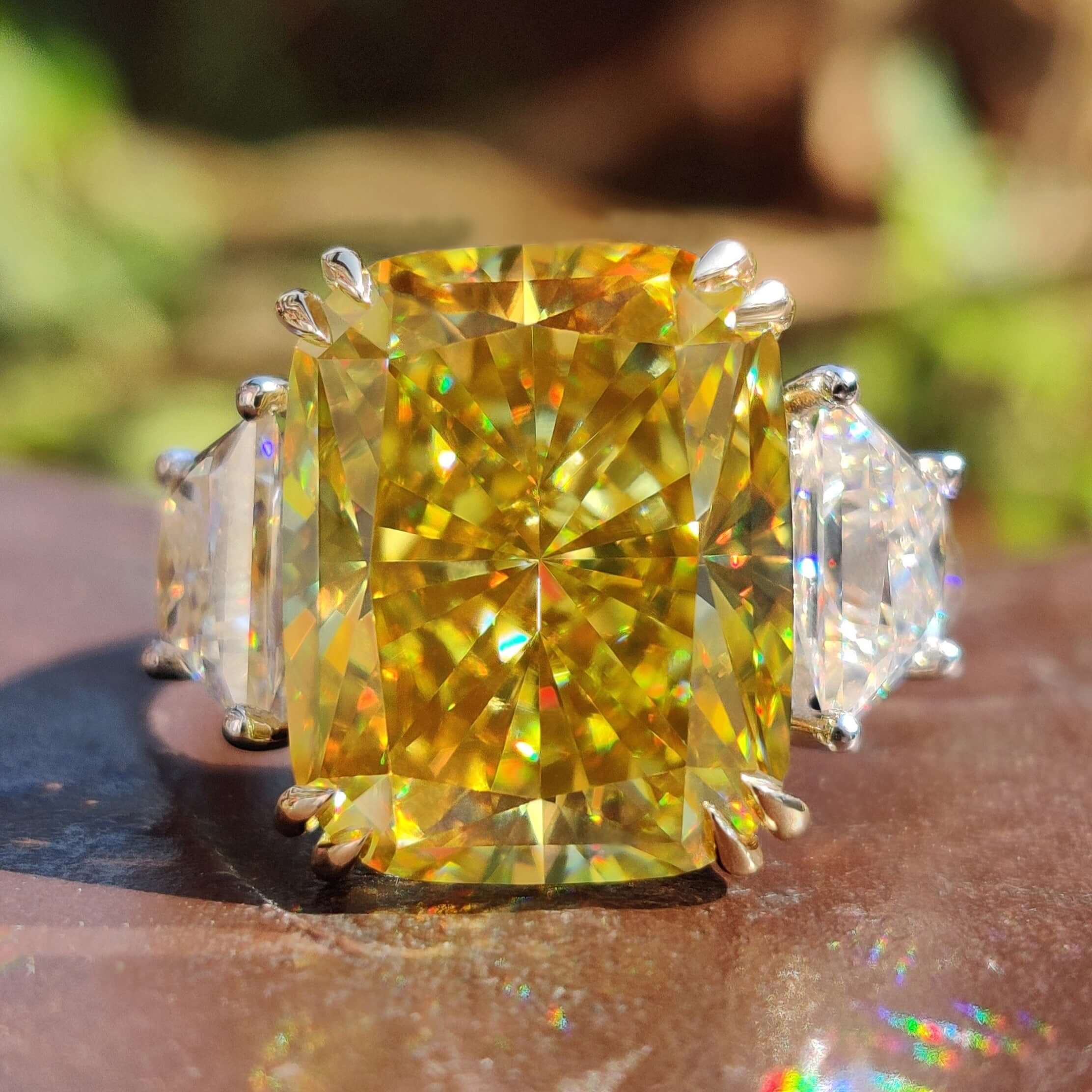 3 stone white gold ring with radiant cut center.