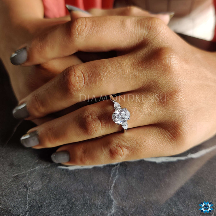 White gold 3-stone ring designed with moissanite.