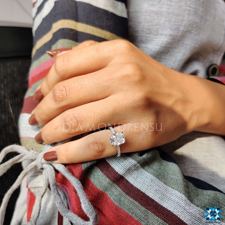 White gold engagement ring with pavé band design.