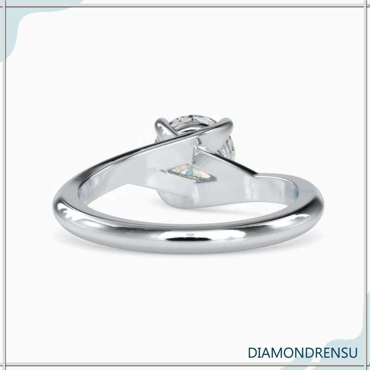 Rose gold engagement ring with solitaire setting and round prong design.