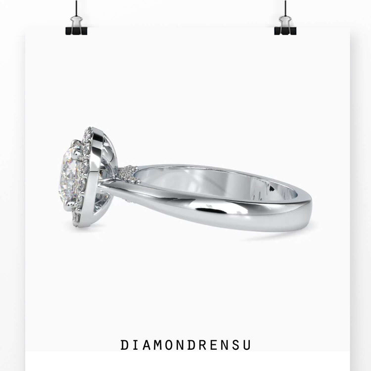 Rose gold ring with halo setting and round cut diamond.