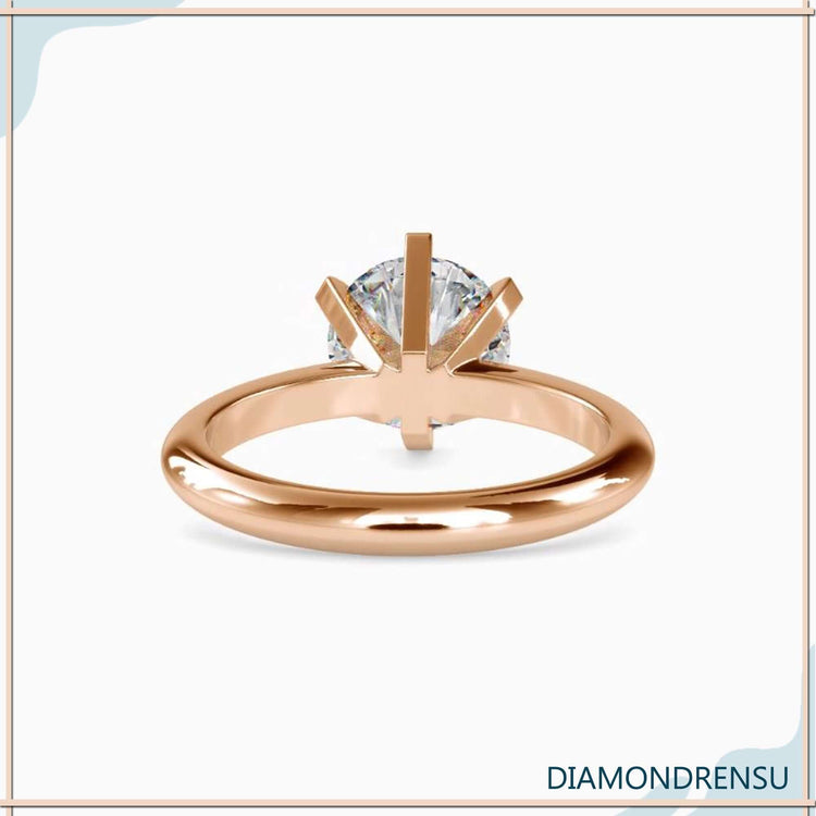 Diamondrensu UK engagement ring with round cut solitaire diamond.