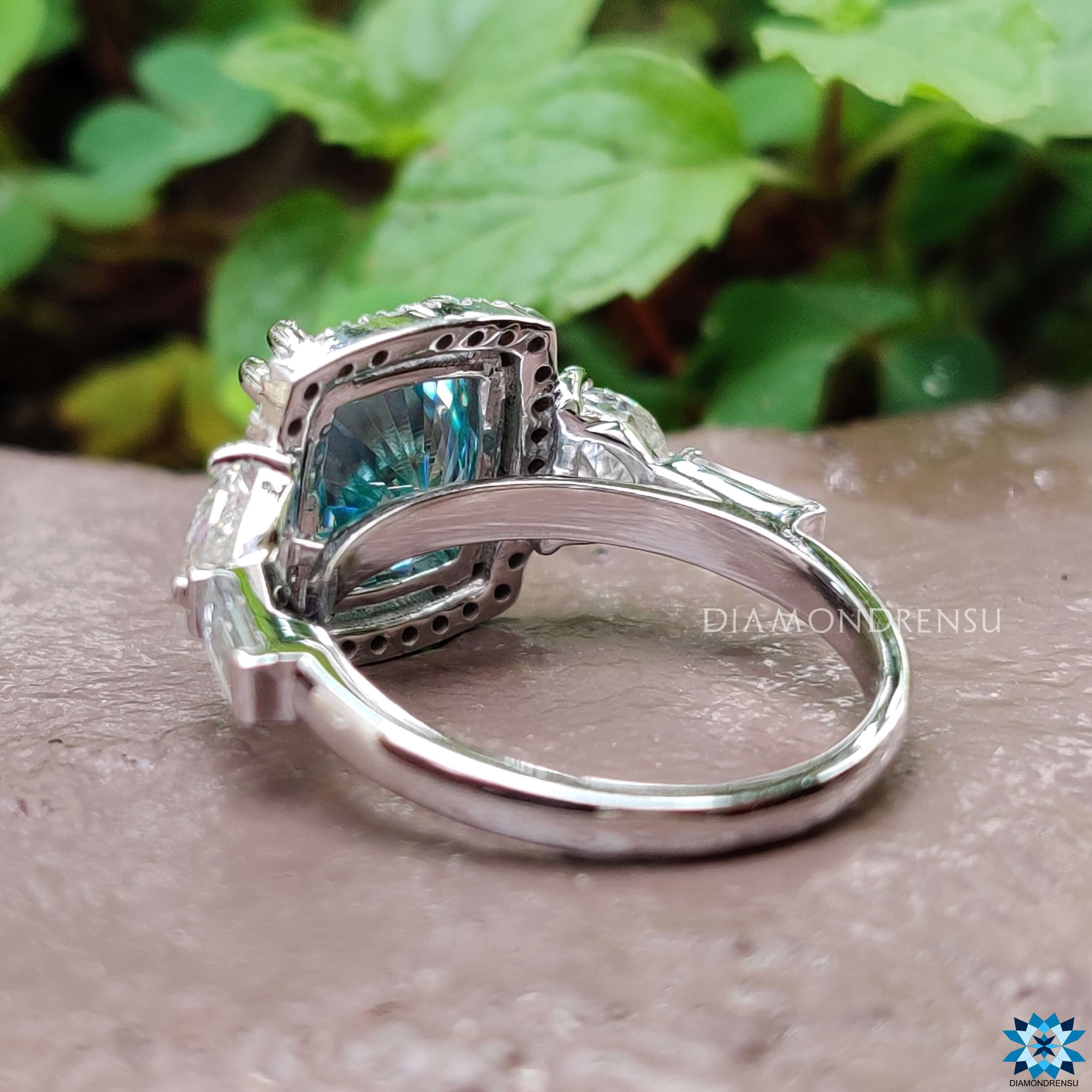 Handmade vintage-style moissanite ring with halo setting.