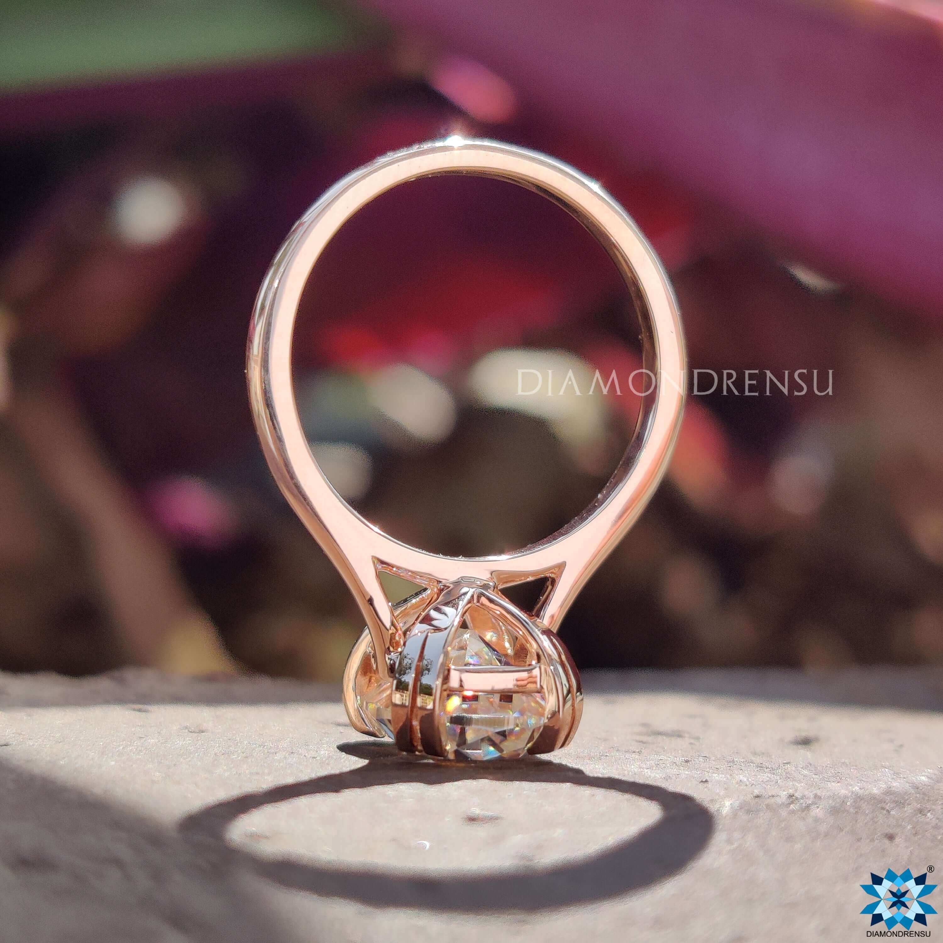 Custom rose gold engagement ring with old European cut center.