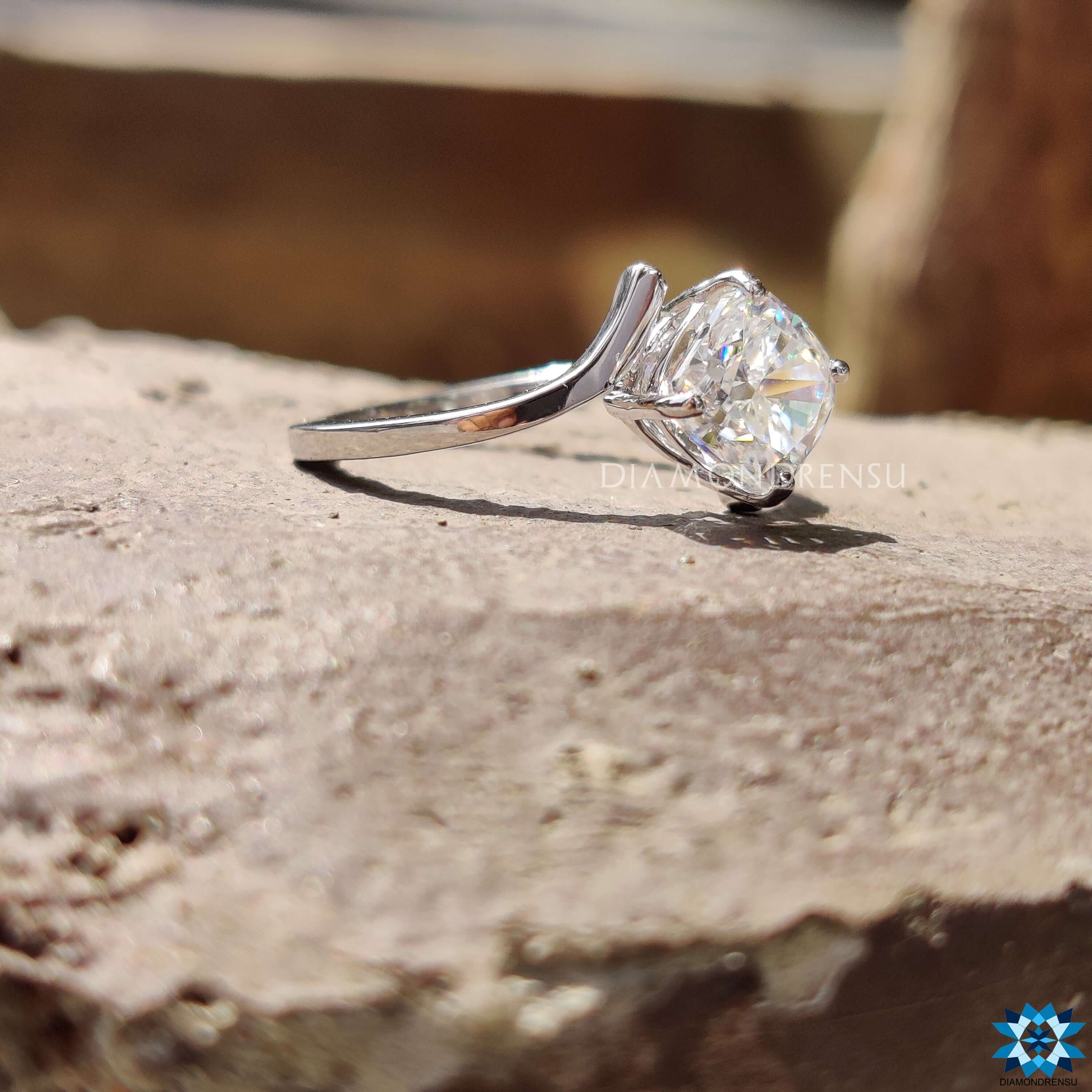 Handmade white gold moissanite ring with prong setting.