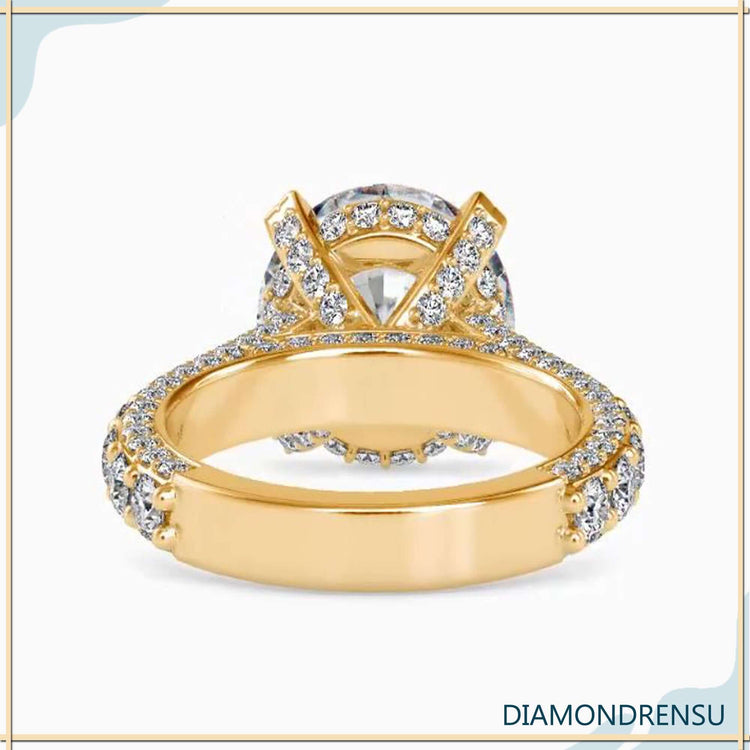 Yellow gold ring with three row pave and bridge detail.