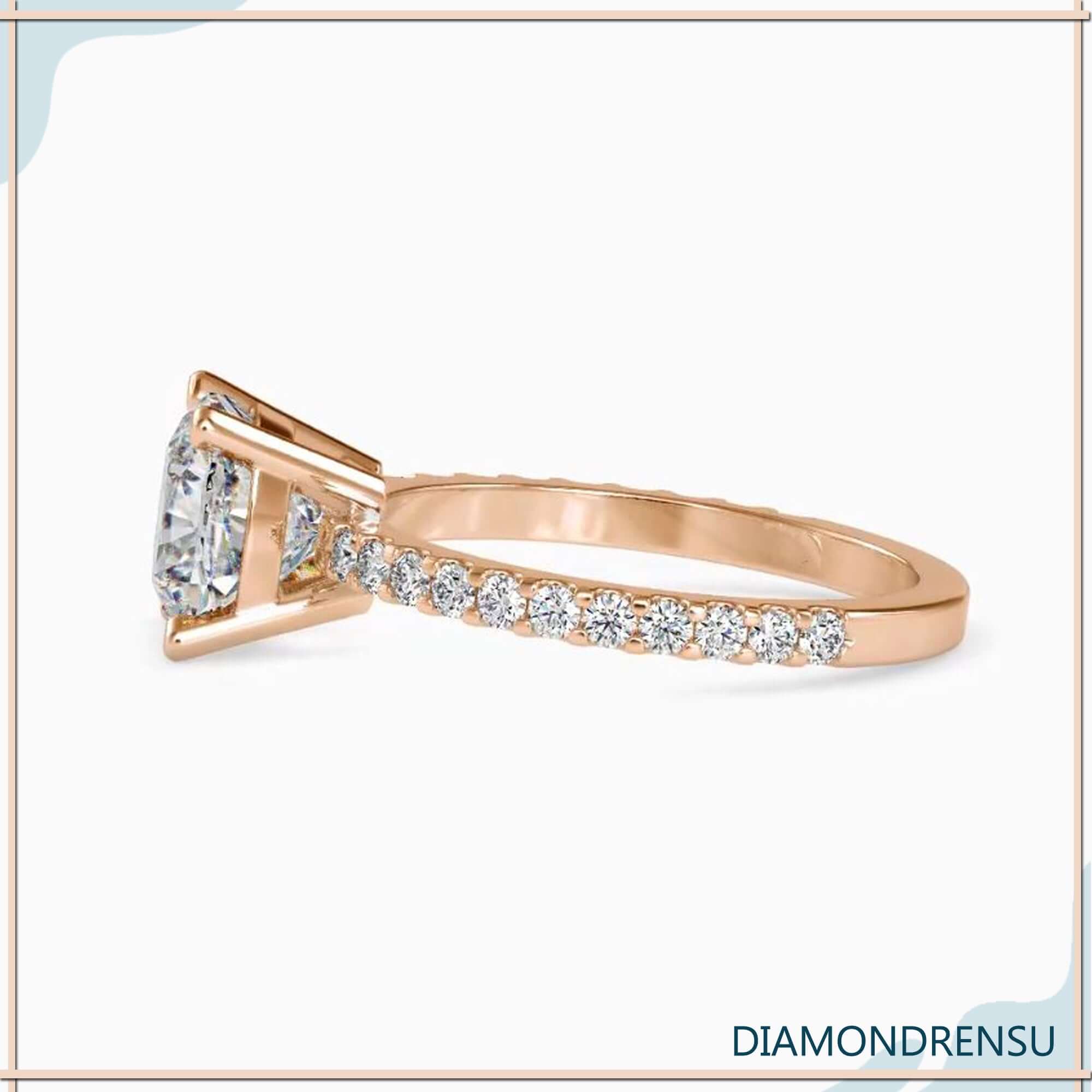 Custom engagement ring with round cut pave and basket setting.