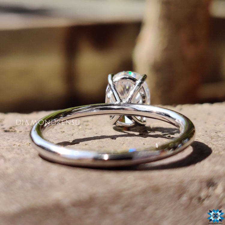 Oval solitaire ring in white gold prong setting.