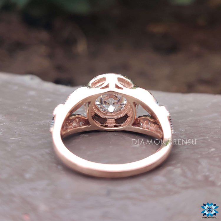 Prong setting moissanite ring in warm rose gold.