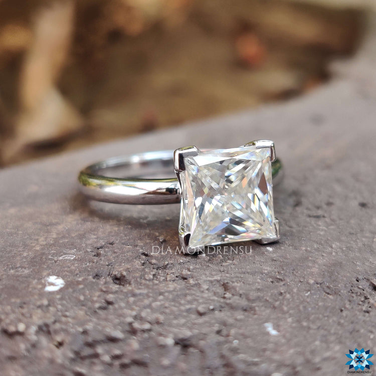 Handmade princess cut engagement ring in white gold.