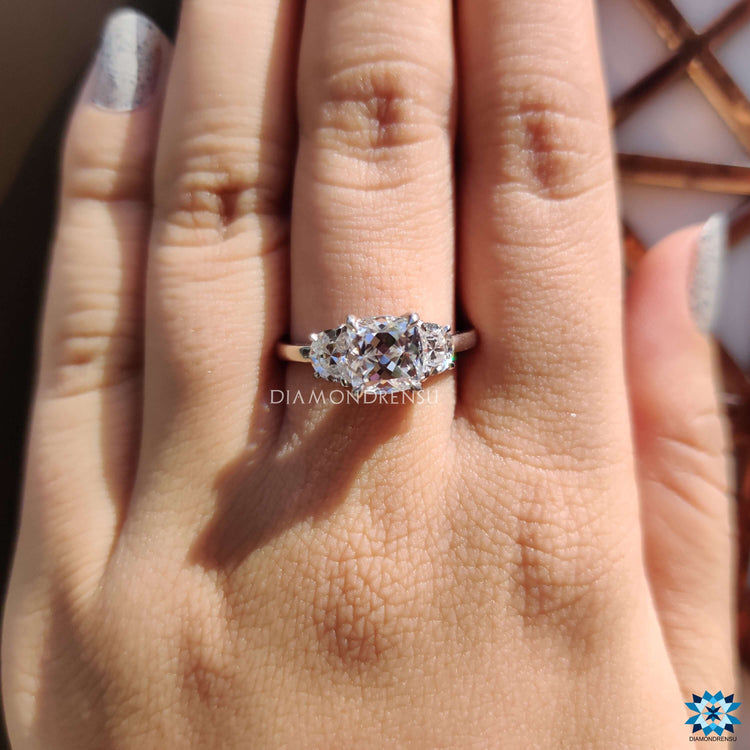 Diamondrensu UK cushion cut moissanite ring with side stones.