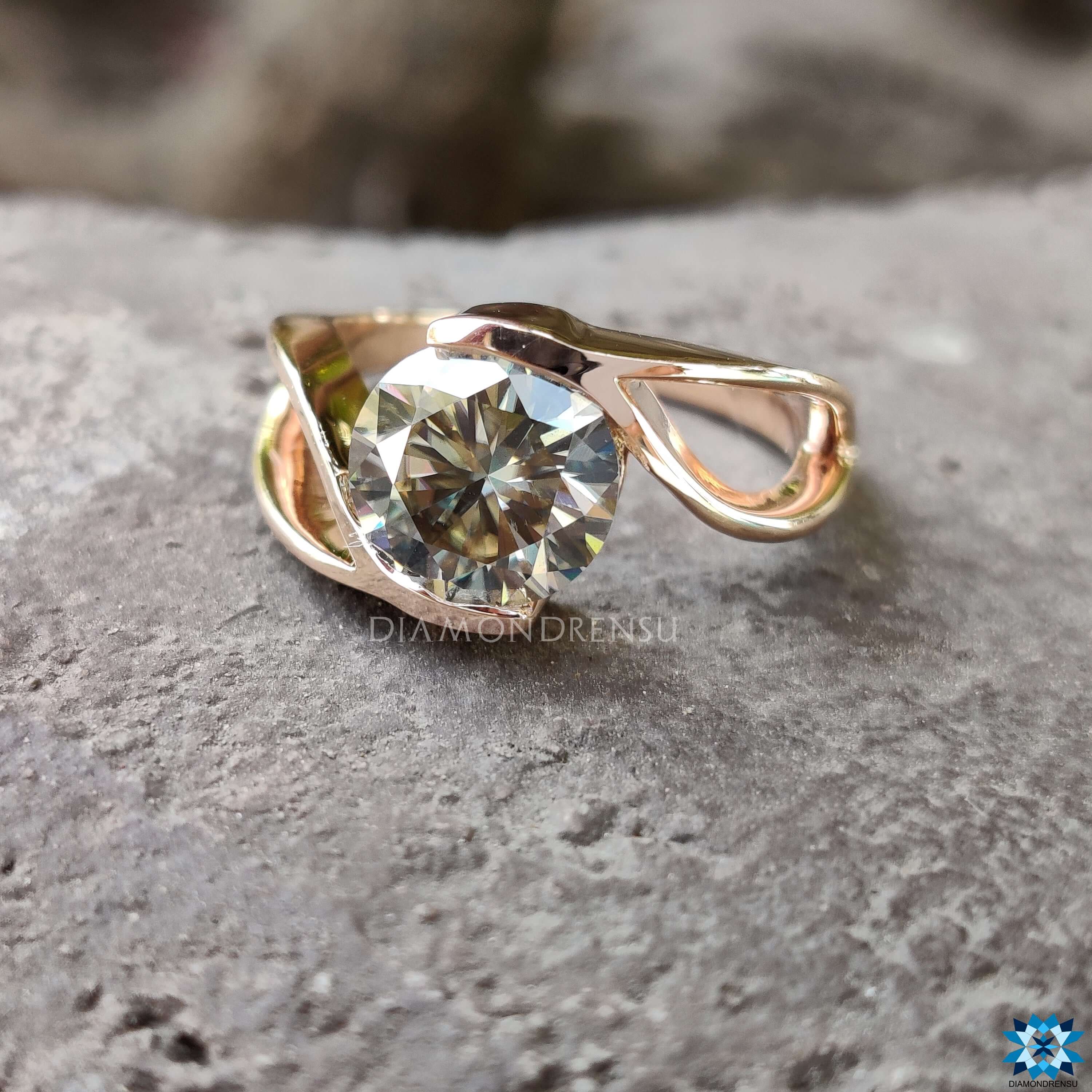 Handmade rose gold ring with round moissanite center.