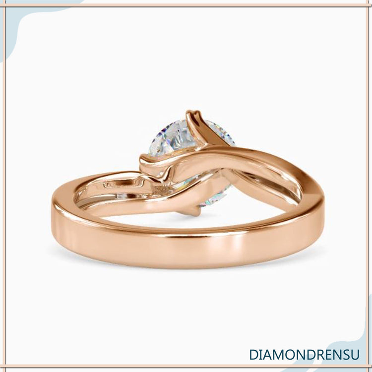Yellow gold diamond ring with solitaire design and handmade ring craftsmanship.