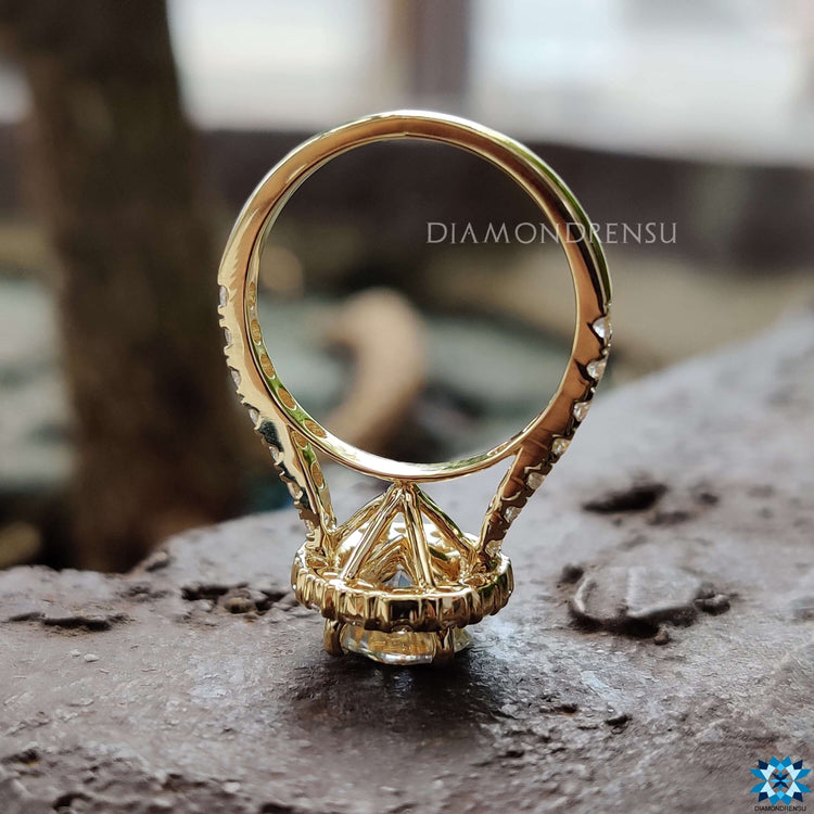 Halo setting engagement ring with round moissanite.