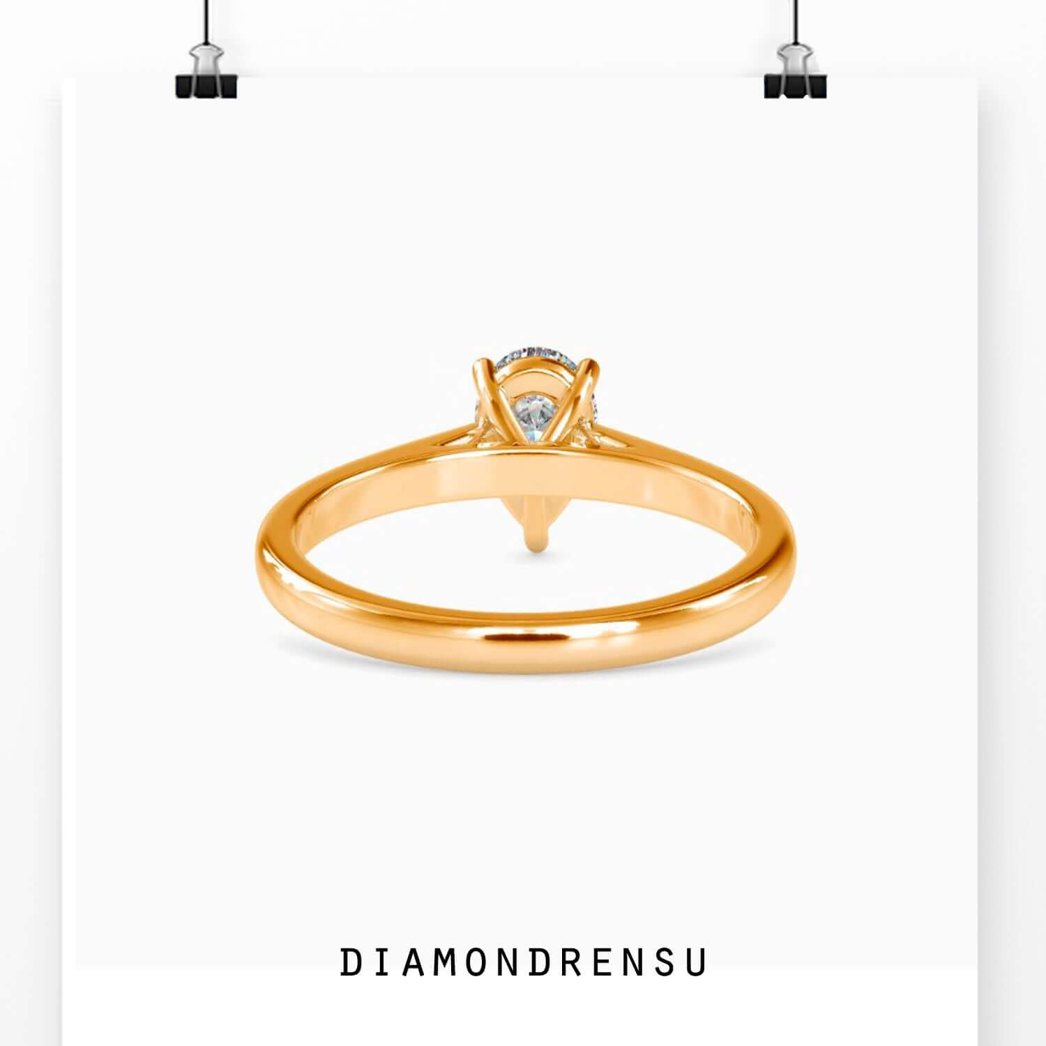 Rose gold solitaire diamond ring with teardrop cut.