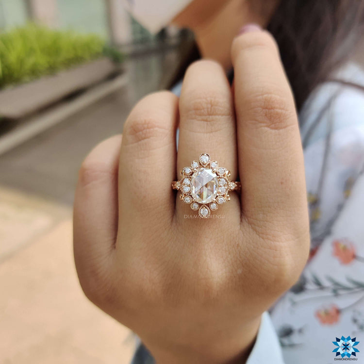Milgrain setting on rose gold flower style ring.