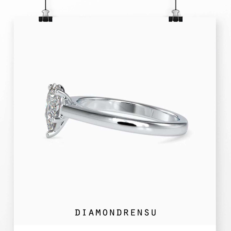 Diamondrensu UK engagement ring with pear shaped diamond.