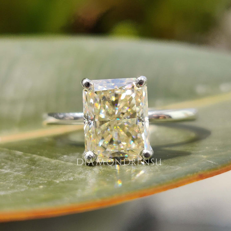 Diamondrensu UK engagement ring with light yellow centre stone in custom design.
