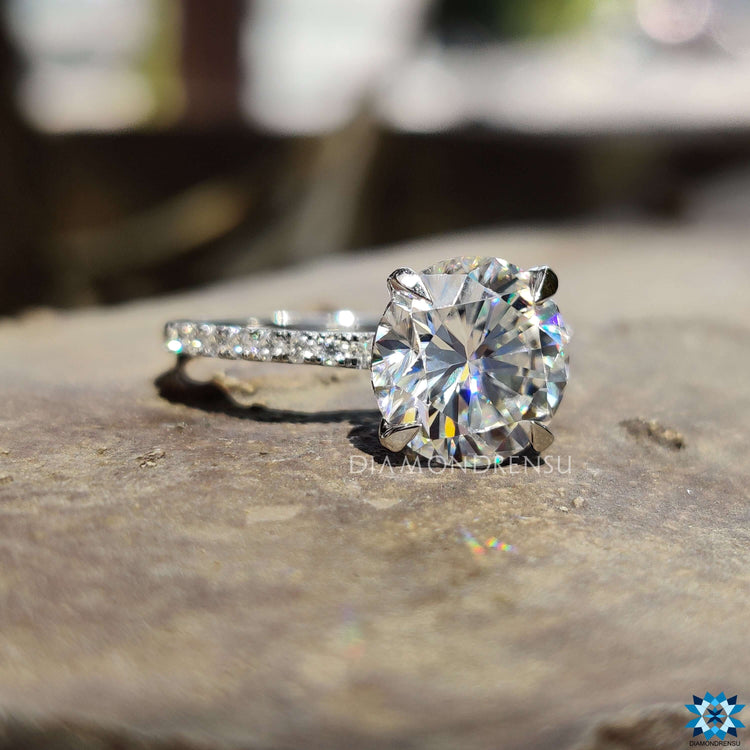 Handmade round cut moissanite ring with prong mount.