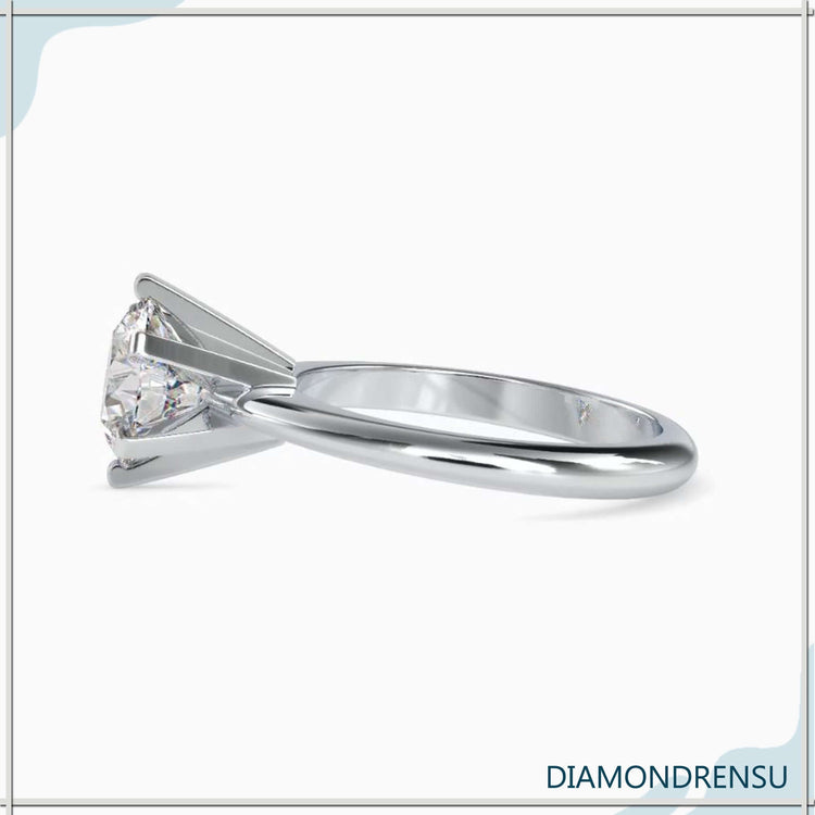 Handmade solitaire engagement ring in yellow gold.