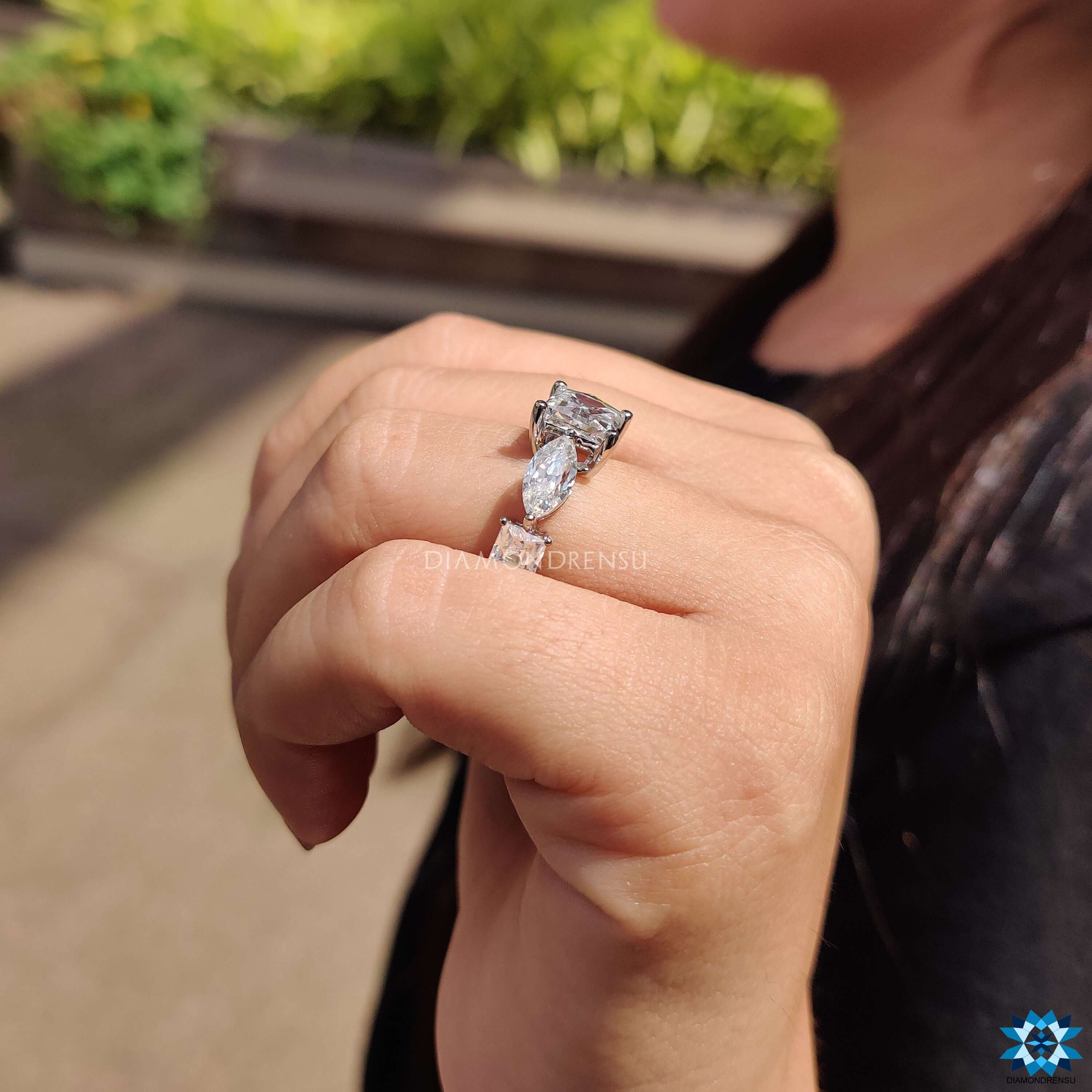 Buy moissanite ring with five stones and marquise side stones.