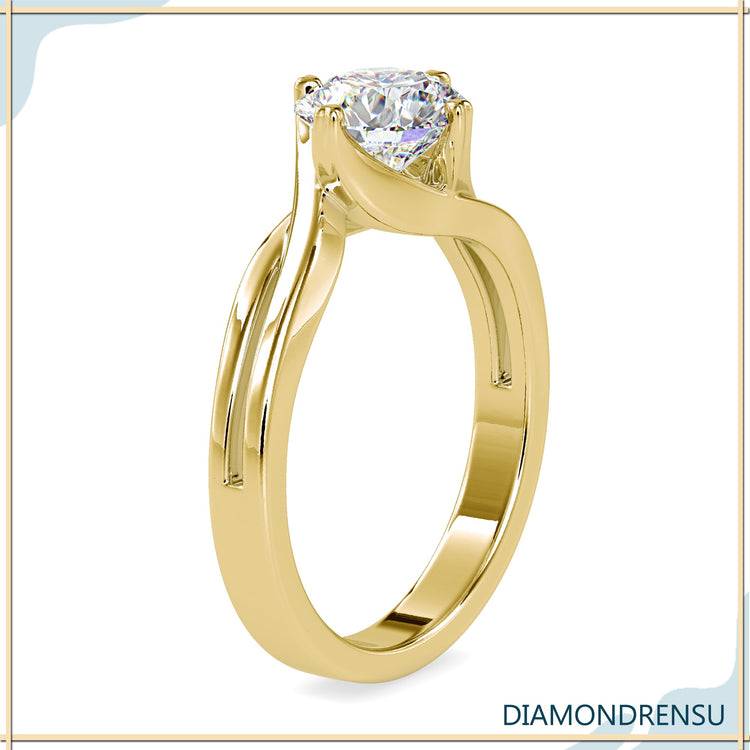 Handmade ring with twisted band and round cut lab grown diamond.
