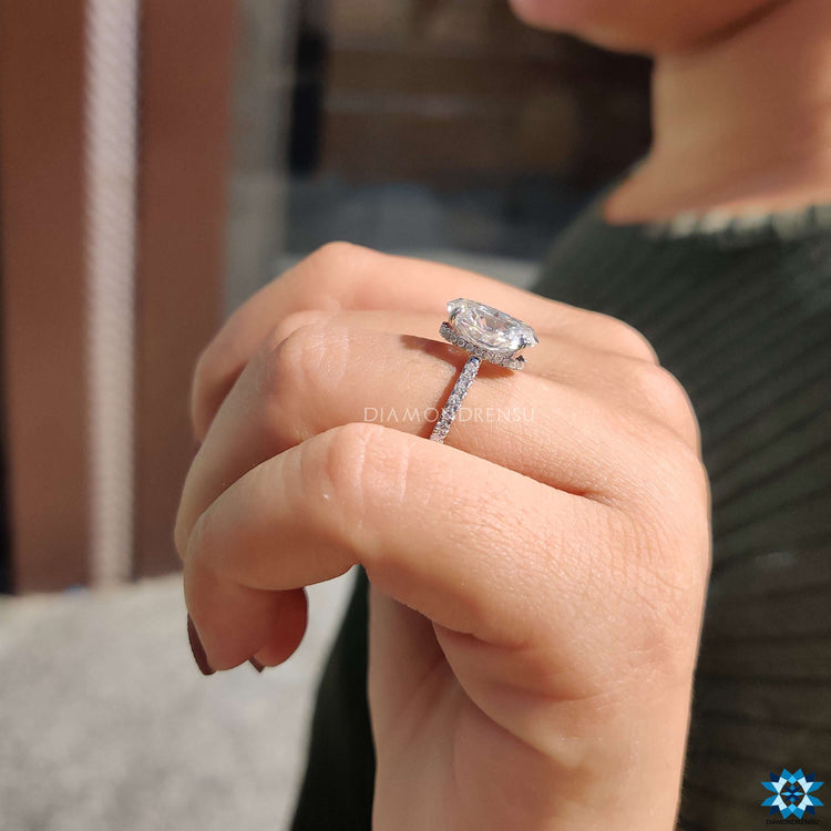 Custom engagement ring with oval crushed ice moissanite.