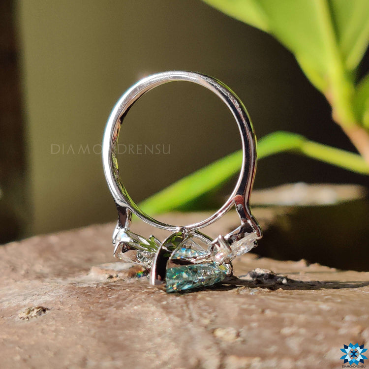 Muse setting pear cut moissanite ring.