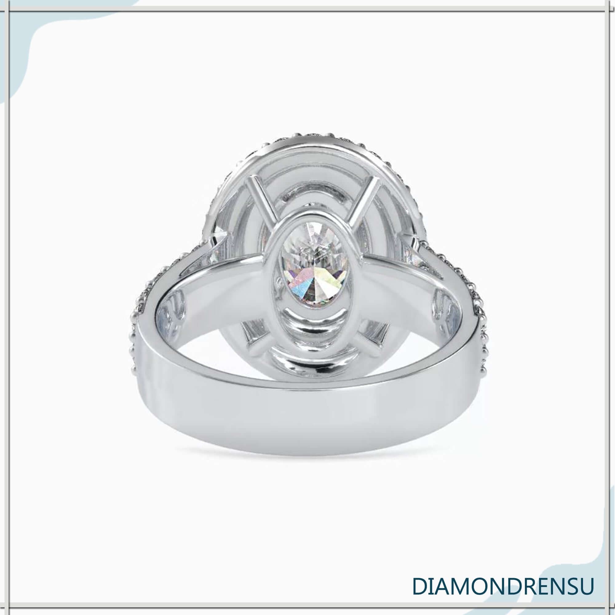 Handmade oval cut engagement ring with double halo in rose gold.