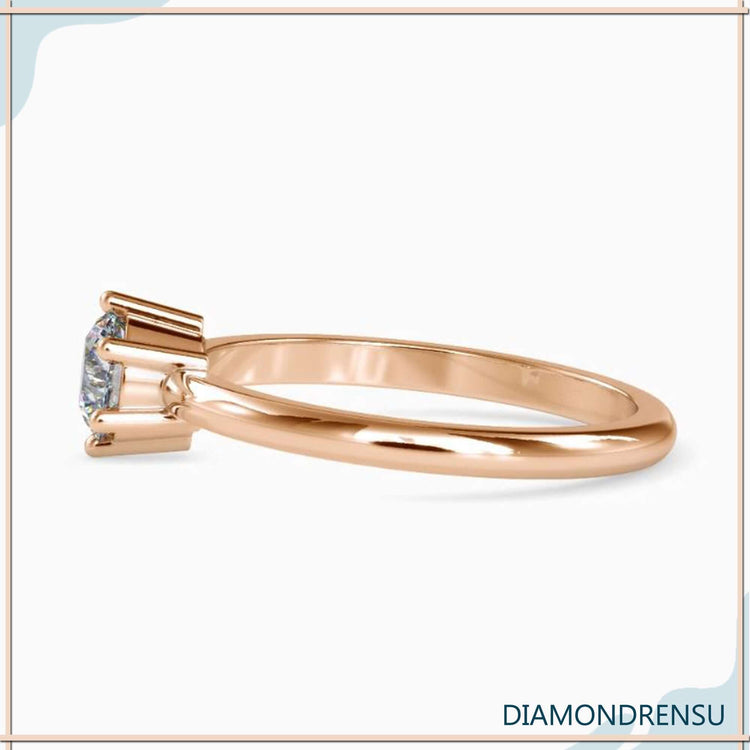 UK engagement ring featuring round cut solitaire with handmade finish.