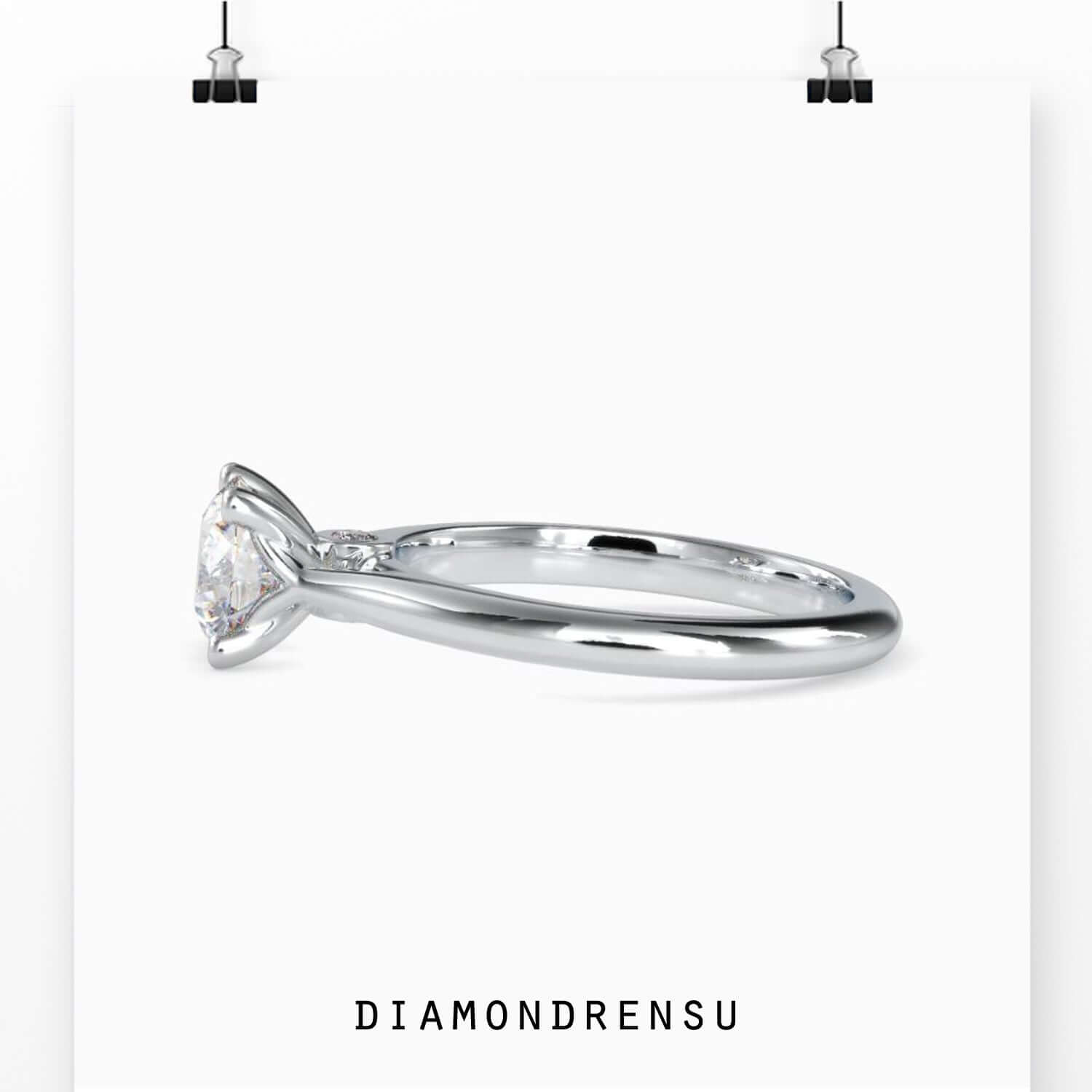 Tapered shank ring in rose gold with round centre.