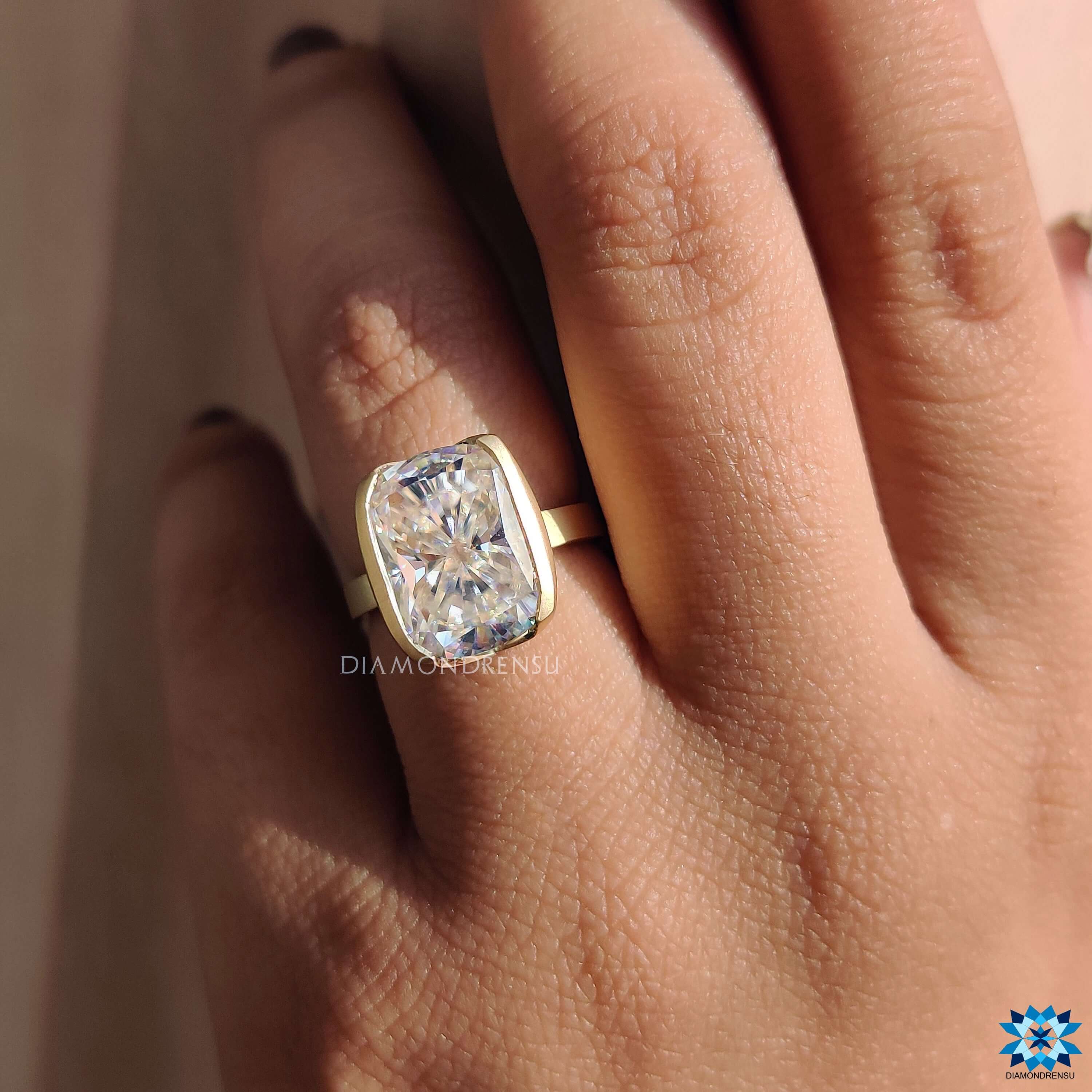Elongated cushion cut moissanite solitaire setting ring.