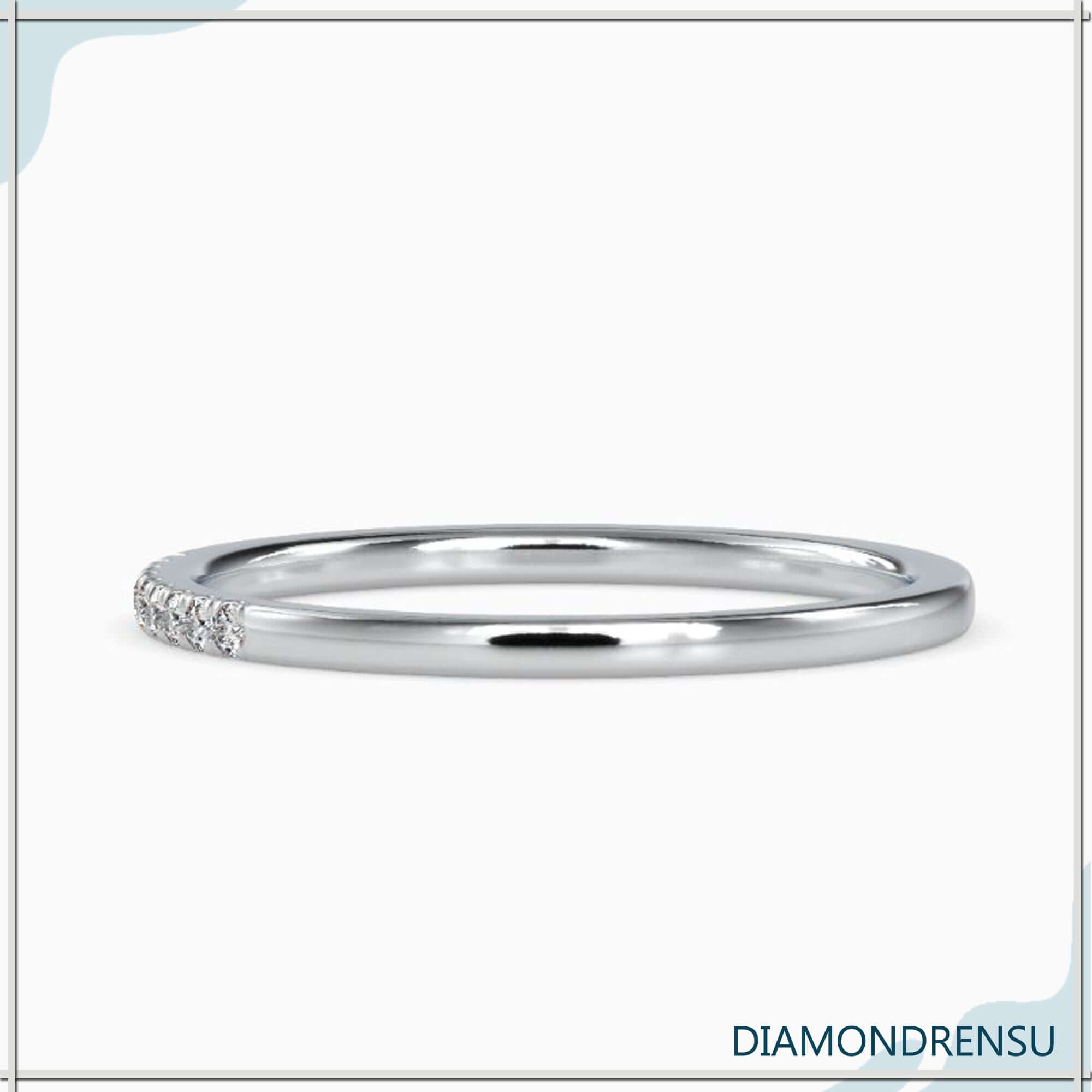 Simple wedding band with lab grown diamond accents.
