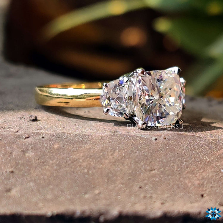 Two tone moissanite ring with yellow and white gold band.
