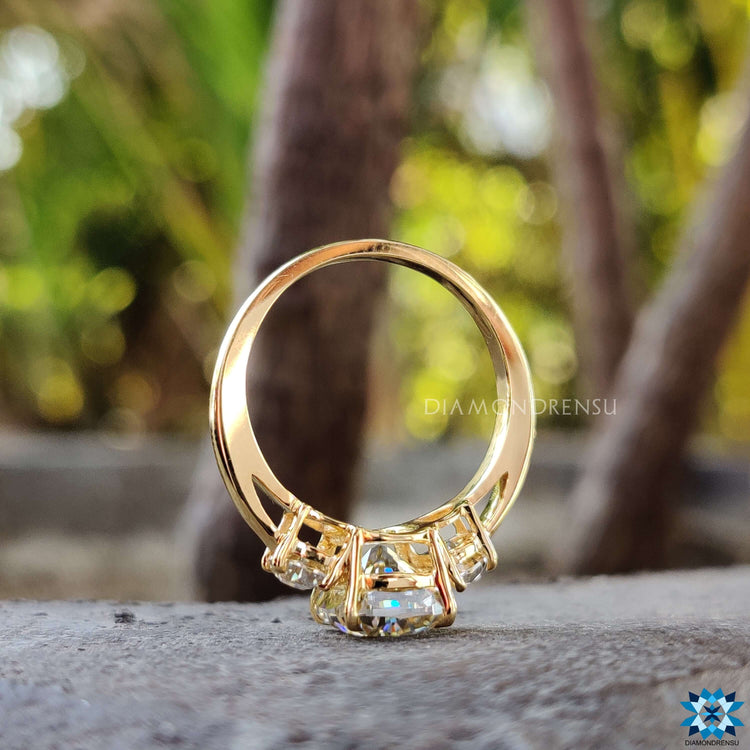 Handmade yellow gold ring with cushion and half moon moissanite.