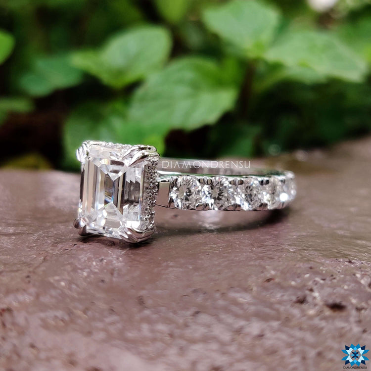 Emerald cut moissanite ring with double claw prong setting.