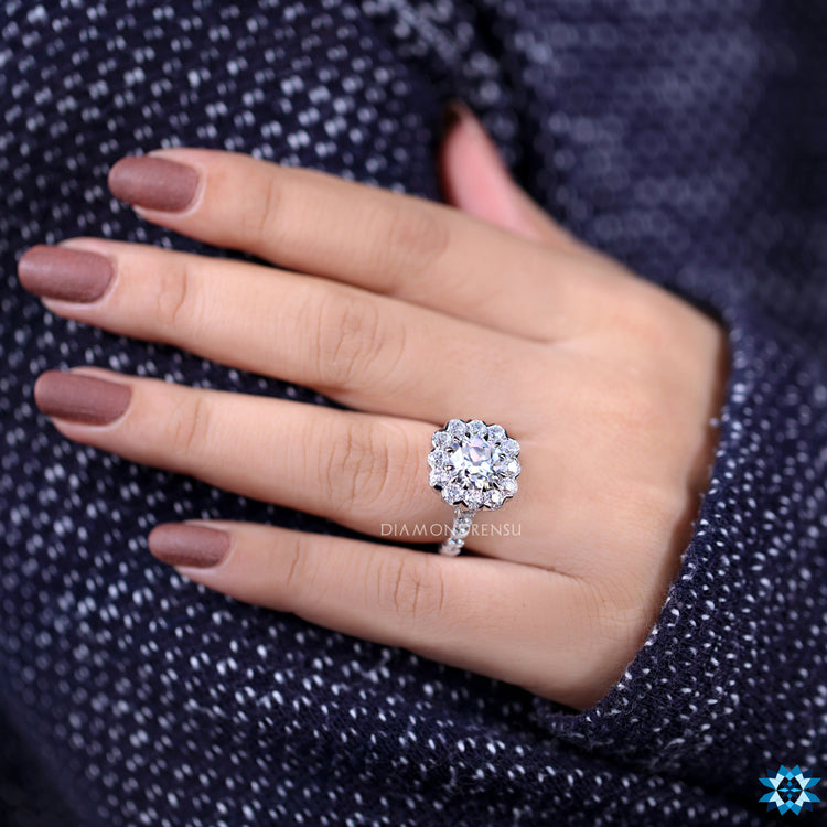 Moissanite pave ring with handmade round cut and cushion setting style.